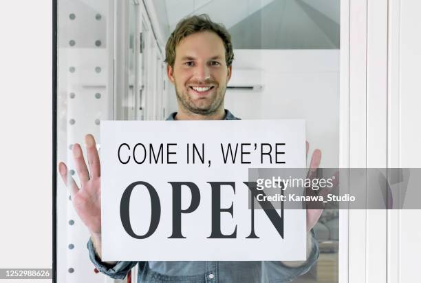 reopening local small business post pandemic - small placard stock pictures, royalty-free photos & images