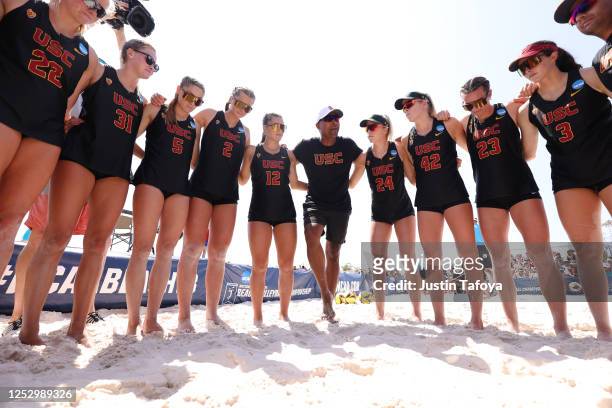 The USC Trojans huddle before taking on the UCLA Bruins in the Division I Women's Beach Volleyball Championship held at Gulf Shores Public Beach on...