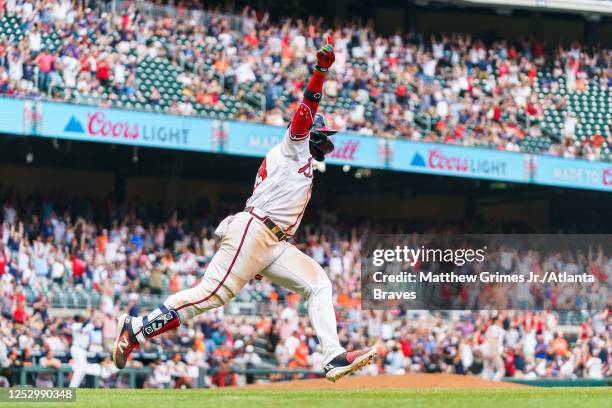 Michael Harris II of the Atlanta Braves celebrates after hitting a walk-off double during the twelfth inning against the Baltimore Orioles at Truist...