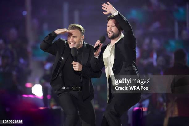 Gary Barlow and Calum Scott of Take That perform during the Coronation Concert on May 7, 2023 in Windsor, England. The Windsor Castle Concert is part...