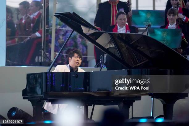 Pianist Lang Lang performs during the Coronation Concert on May 7, 2023 in Windsor, England. The Windsor Castle Concert is part of the celebrations...