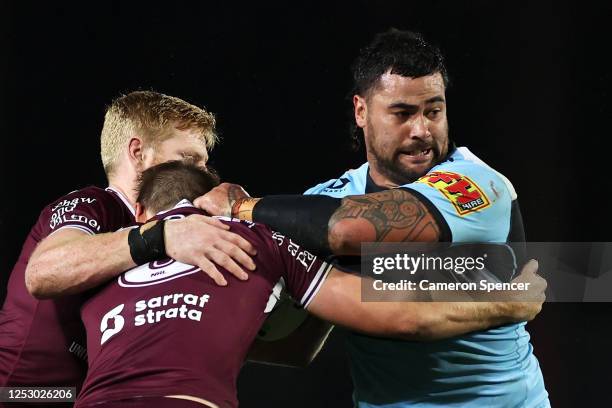 Andrew Fifita of the Sharks is tackled during the round seven NRL match between the Manly Sea Eagles and the Cronulla Sharks at Central Coast Stadium...