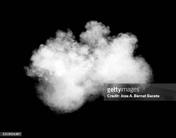 explosion of a white cloud of smoke on a black background. - fonds de nuage photos et images de collection