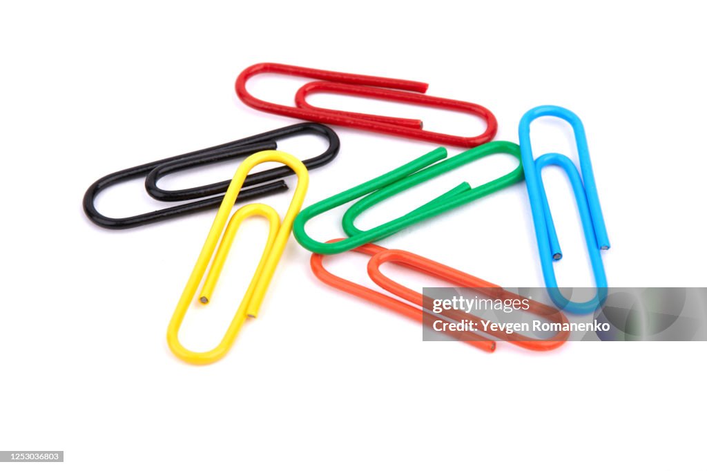 Colourful paper clips isolated on white background