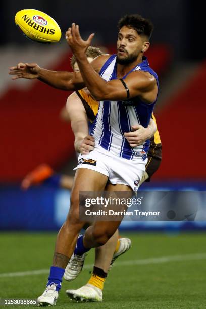 James Sicily of the Hawks tackles Aaron Hall of the Kangaroos during the round 4 AFL match between the Hawthorn Hawks and the North Melbourne...