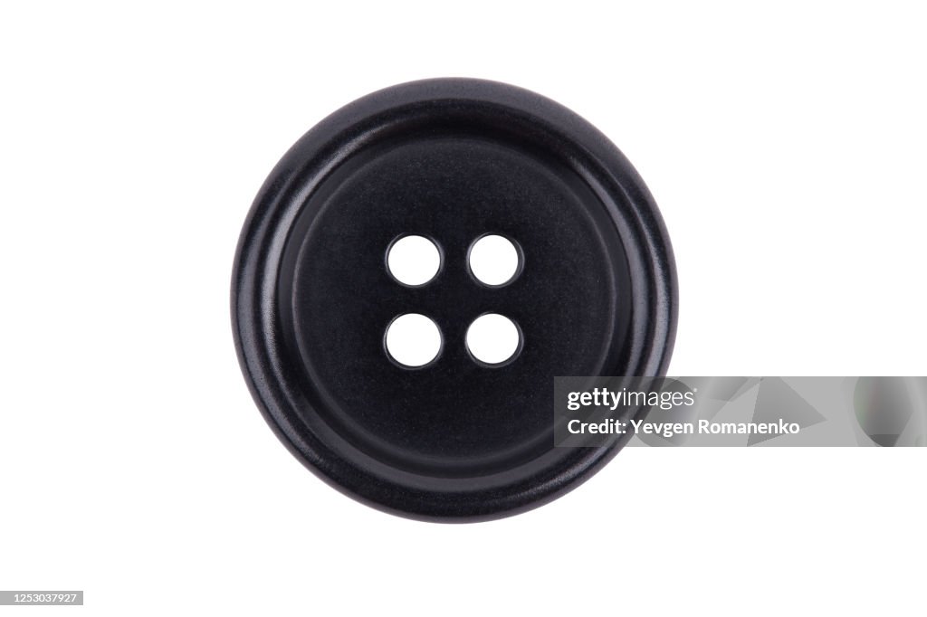 Black sewing button isolated on white background