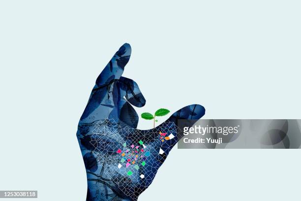 cyborg hands and young leaves - reduce stock pictures, royalty-free photos & images