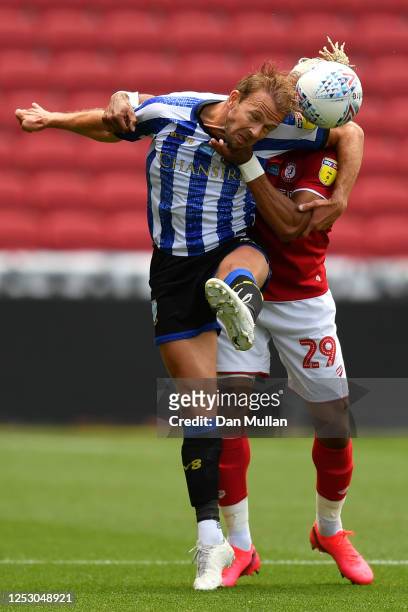 Jordan Rhodes of Sheffield Wednesday feels the challenge from Ashley Williams of Bristol City during the Sky Bet Championship match between Bristol...