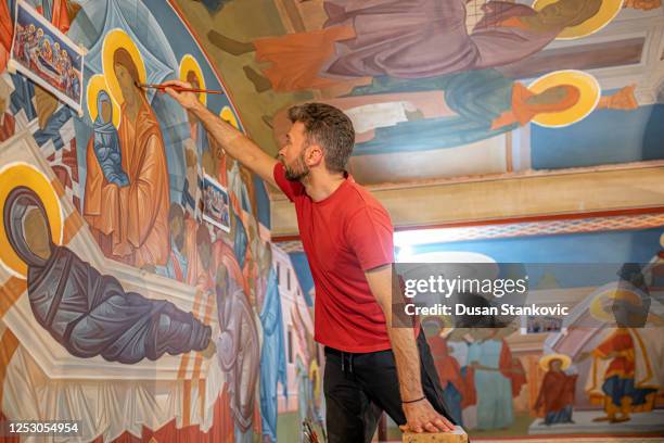 male artist working in a church - restoring art stock pictures, royalty-free photos & images