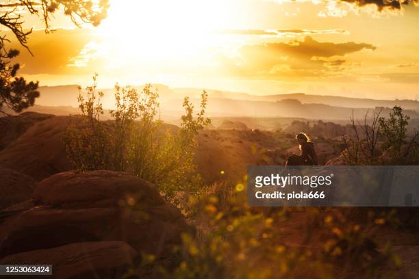 woman hiking in the majestic desert landscapes of south west usa: outdoors adventures - canyon utah imagens e fotografias de stock