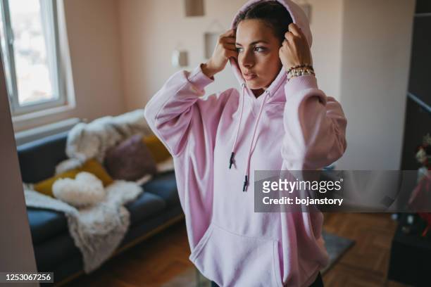 getting ready to go out - hood clothing stock pictures, royalty-free photos & images