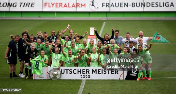 Players of Wolfsburg celebrate with the trophy to celebrate the championship following the Flyeralarm Frauen Bundesliga match between VfL Wolfsburg...