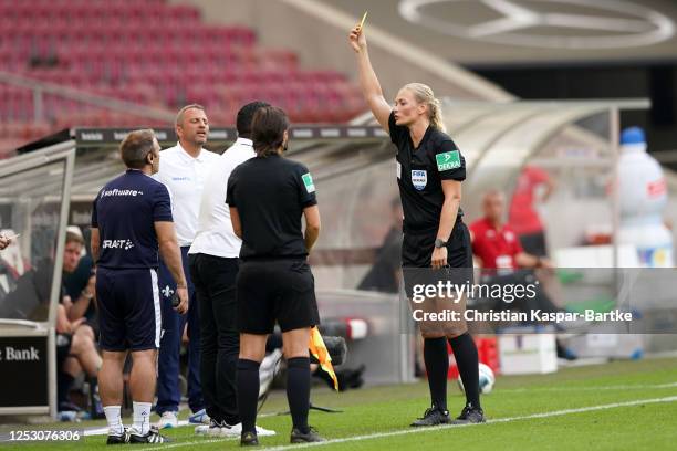 Head Coach of SV Darmstadt 98 Dimitrios Grammozis is shown a yellow card by referee Bibiana Steinhaus during the Second Bundesliga match between VfB...