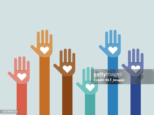 illustration of group of multi-colored hands raised together - social justice concept stock illustrations