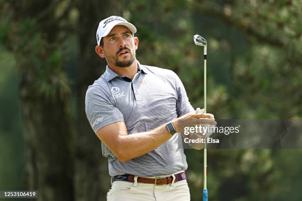 Scott Stallings of the United States plays his shot from the fifth tee during the final round of the Travelers Championship at TPC River Highlands on...