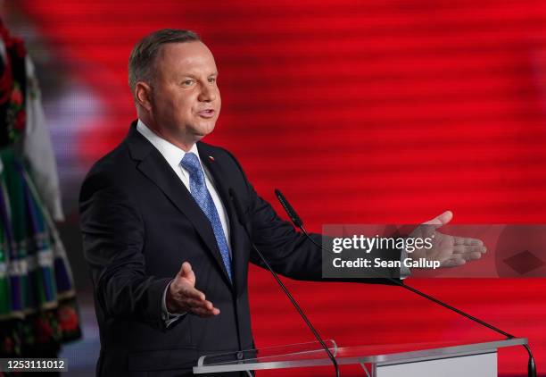 Polish President and member of the right-wing Law and Justice party Andrzej Duda speaks to supporters following initial results in the Polish...