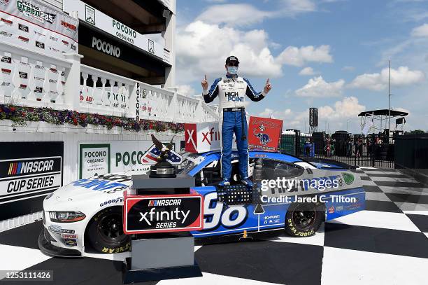 Chase Briscoe, driver of the Highpoint.com Ford, celebrates in Victory Lane after winning the NASCAR Xfinity Series Pocono Green 225 Recycled by J.P....