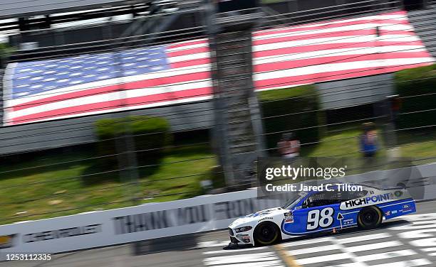 Chase Briscoe, driver of the Highpoint.com Ford, crosses the finish line to win the NASCAR Xfinity Series Pocono Green 225 Recycled by J.P. Mascaro &...