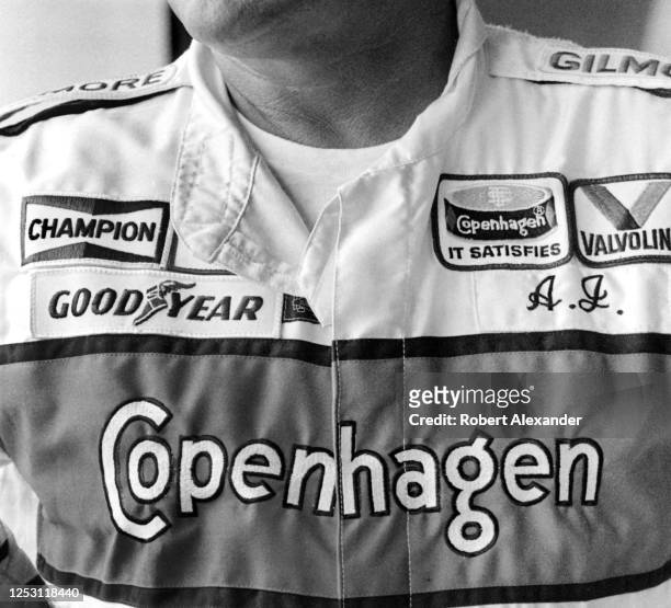 Driver A.J. Foyt stands in the speedway garage prior to the start of the 1985 Pepsi Firecracker 400 stock car race at Daytona International Speedway...