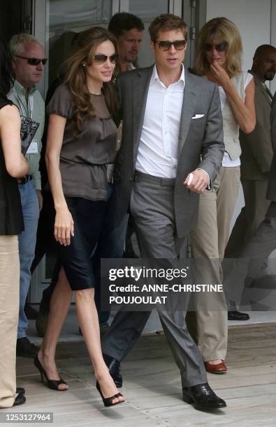 Actress Angelina Jolie and actor and producer Brad Pitt leave 21 May 2007 the Festival Palace in Cannes, southern France, following a press...