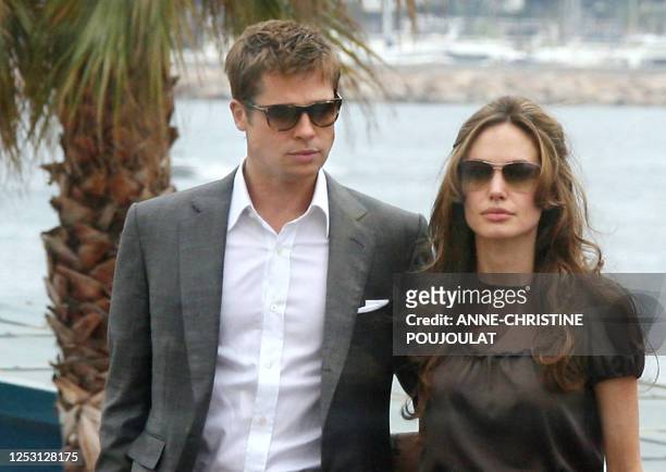 Actor and co-producer Brad Pitt and actress Angelina Jolie arrive 21May 2007 to attend a photocall for British director Michael Winterbottom's film...