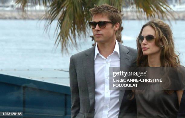 Actor and co-producer Brad Pitt and actress Angelina Jolie arrive 21May 2007 to attend a photocall for their film 'A Mighty Heart' in the Festival...