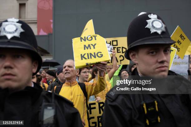 Civilians protest during a peaceful anti-monarch protest at Trafalgar Square during the coronation of Charles III and Camilla as King and Queen of...