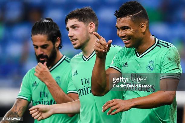 Casemiro of Real Madrid CF celebrates with his team mates Isco and Federico Valverde after scoring his team's first goal during the Liga match...