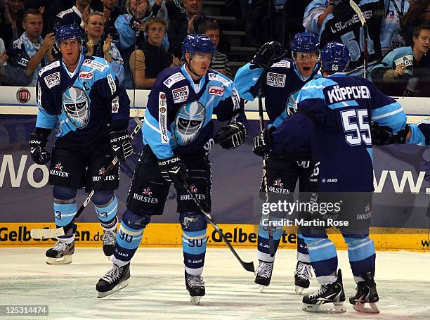 David Wolf of Hamburg celebrate with his team mates his team's opening goal the DEL match between Hamburg Freezers and Adler Mannheim at the O2 World...