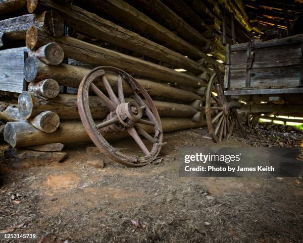 a pioneer homestead. - wagon wheel stock pictures, royalty-free photos & images