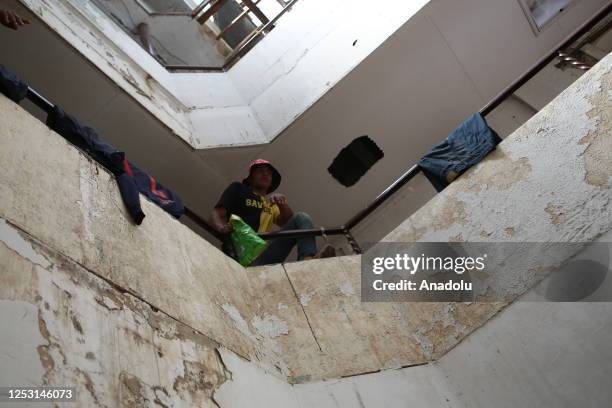 Migrants, living in risky hotel, are seen as authorities notify them to evacuate the hotel in Ciudad Juarez on Mexico on April 20, 2023. Civil...