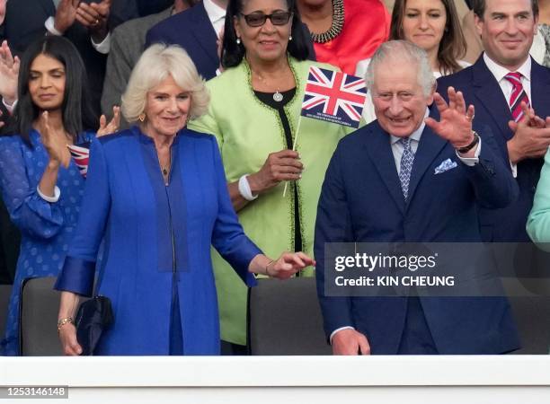 Britain's Queen Camilla and Britain's King Charles III arrive to attend the Coronation Concert at Windsor Castle in Windsor, west of London on May 7,...