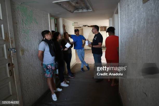 Migrants, living in risky hotel, are seen as authorities notify them to evacuate the hotel in Ciudad Juarez on Mexico on April 20, 2023. Civil...