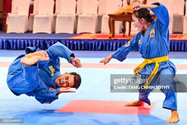 Cambodia's Meth Sopheaktra and Pal Chhor Raksmy perform in the women's Vovinam self-defense event during the 32nd Southeast Asian Games in Phnom Penh...