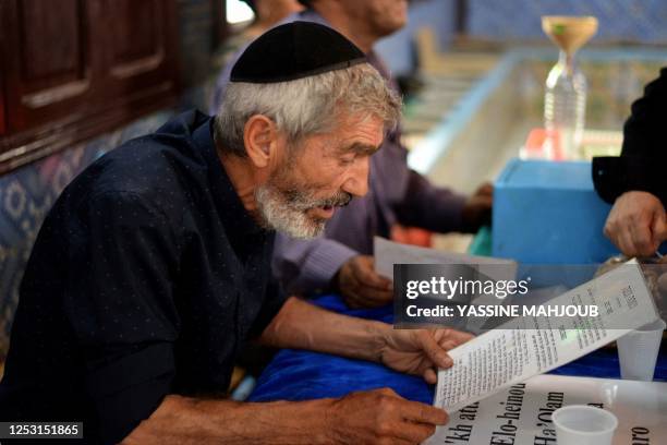 Jewish pilgrim prays at the Ghriba synagogue in Tunisia's southern resort island of Djerba on May 8, 2023 during the annual Jewish pilgrimage to the...