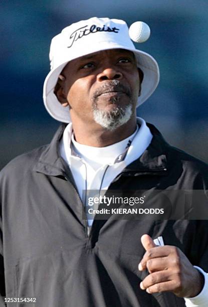 American actor Samuel L. Jackson tosses a ball on the golf course 05 October during the second round of the EPGA championship at the St Andrew's Old...