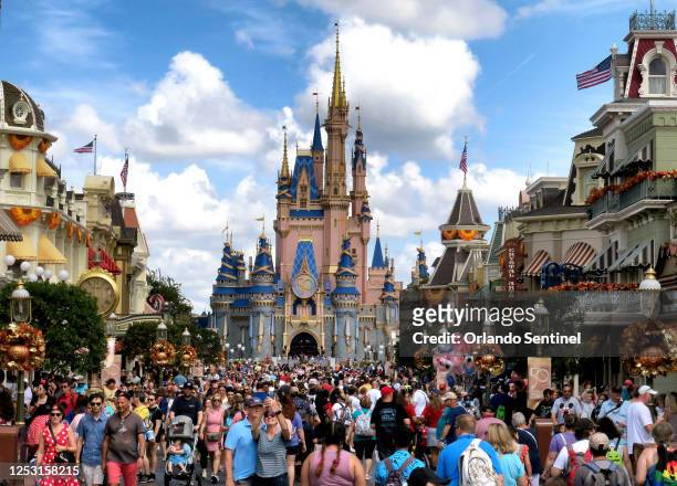 Crowds fill Main Street USA in front of Cinderella Castle at the Magic Kingdom on the 50th anniversary of Walt Disney World, in Lake Buena Vista,...