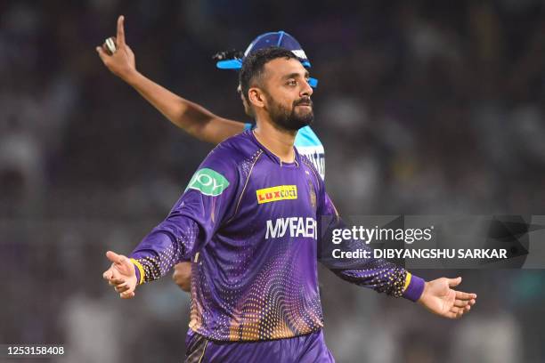 Kolkata Knight Riders' Varun Chakravarthy celebrates after the dismissal of Punjab Kings' Liam Livingstone during the Indian Premier League Twenty20...