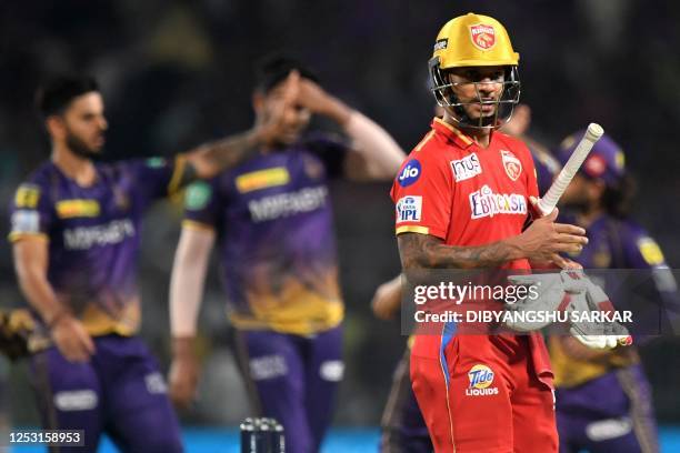 Punjab Kings' Shikhar Dhawan walks back to the pavilion after his dismissal during the Indian Premier League Twenty20 cricket match between Kolkata...