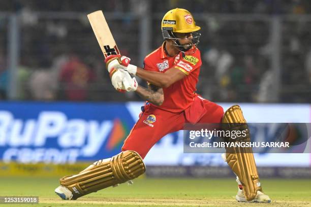 Punjab Kings' Shikhar Dhawan plays a shot during the Indian Premier League Twenty20 cricket match between Kolkata Knight Riders and Punjab Kings at...