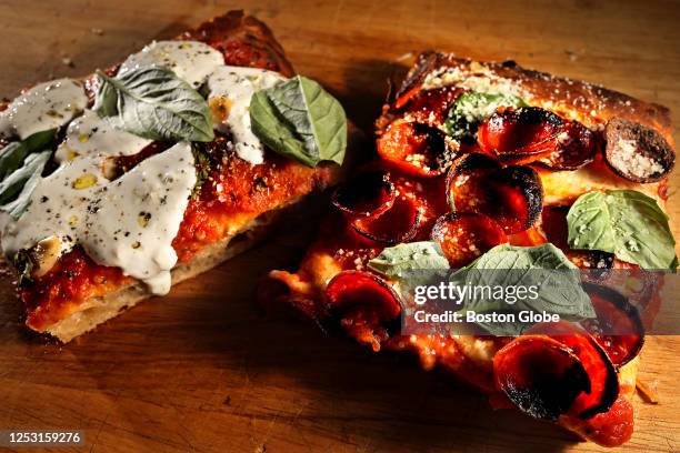 From left, Rosso with buratta slice and pepperoni slice at Pizza Project in the Speedway Building.