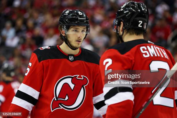 New Jersey Devils defenseman John Marino chats with New Jersey Devils defenseman Brendan Smith during Game 3 of an Eastern Conference Second Round...