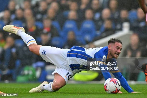 Brighton's Argentinian midfielder Alexis Mac Allister falls during the English Premier League football match between Brighton and Hove Albion and...