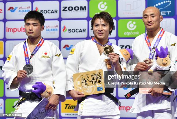 Joshiro Maruyama of Japan, Abe Hifumi of Japan, Bashuu Yondonperenlei of Mongolia posing with medals during the medal ceremony in Men's -66kg during...