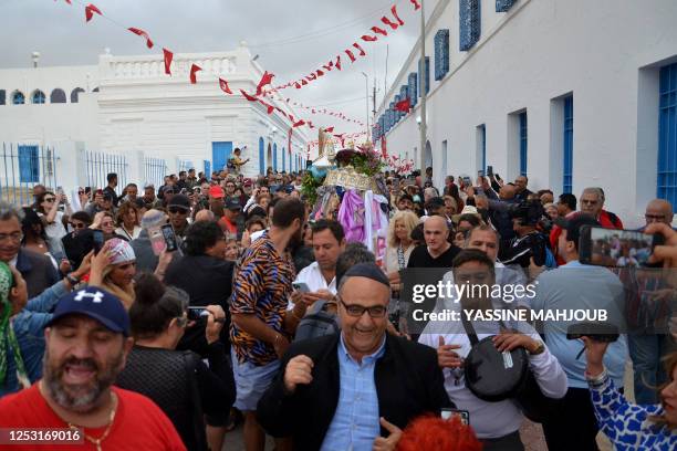 Jewish worshippers attend the annual Jewish pilgrimage to the Ghriba synagogue in Tunisia's southern resort island of Djerba, on May 8, 2023.