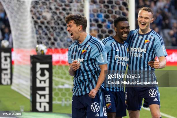 Djurgarden's Gustav Wikheim celebrates with teammates Joel Asoro and Piotr Johansson after scoring the 3-0 goal during an Allsvenskan match between...