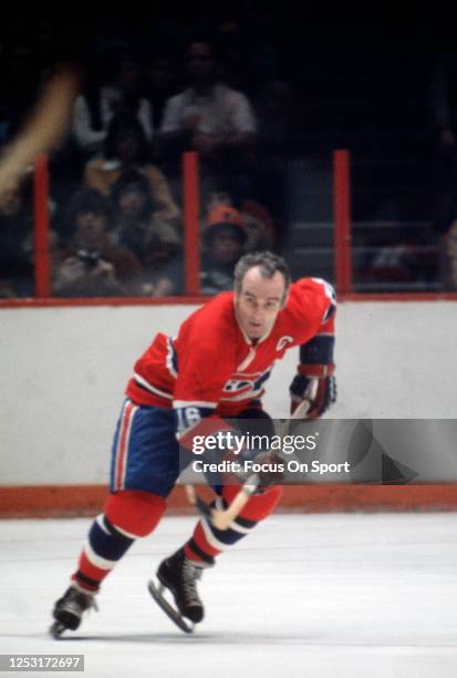 Henri Richard of the Montreal Canadiens skates against the Philadelphia Flyers during an NHL Hockey game circa 1974 at The Spectrum in Philadelphia,...