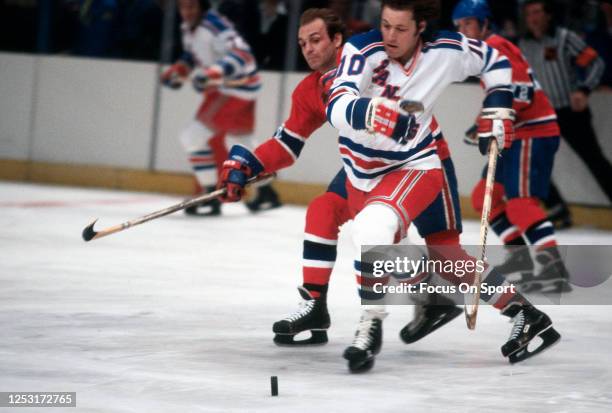 Guy Lafleur of the Montreal Canadiens skates against Ron Duguay of the New York Rangers during an NHL Hockey game circa 1979 at Madison Square Garden...