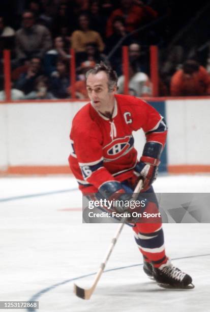 Henri Richard of the Montreal Canadiens skates against the Philadelphia Flyers during an NHL Hockey game circa 1974 at The Spectrum in Philadelphia,...