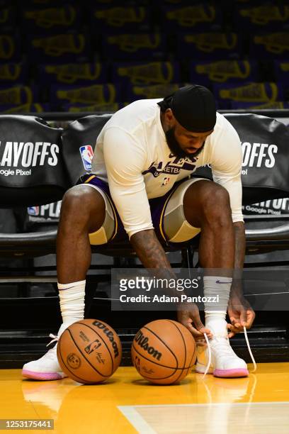 LeBron James of the Los Angeles Lakers warms up before the game Game Four of the Western Conference Semi-Finals of the 2023 NBA Playoffs against the...